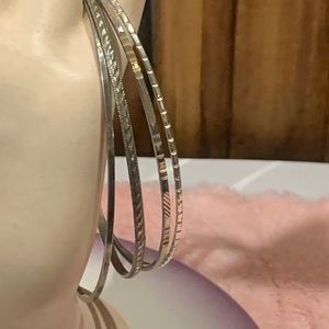 Set of 4 silver tone Bracelets